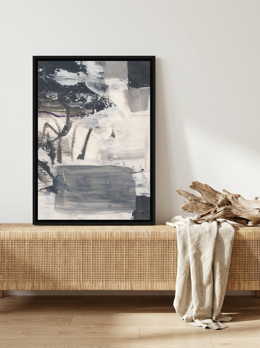 Canvas wall art with a black surround standing on a sideboard in a coastal living room