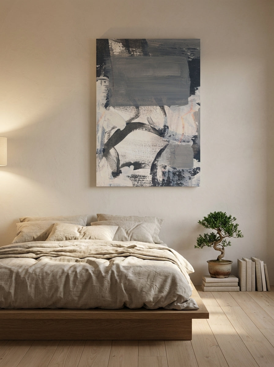 Stretched canvas wall art styled on the wall in a warm Japandi bedroom