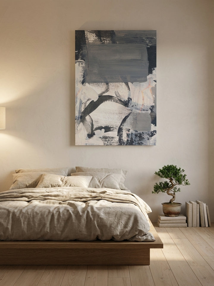 Stretched canvas wall art styled on the wall in a warm Japandi bedroom