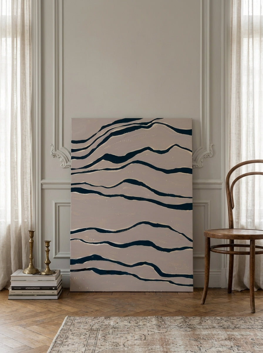 Stretched canvas wall art leaning against the wall in a Parisian bedroom