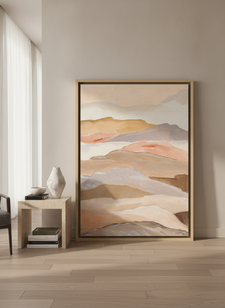 Oversized statement canvas wall art with a natural timber surround leaning against the wall in a luxe bedroom