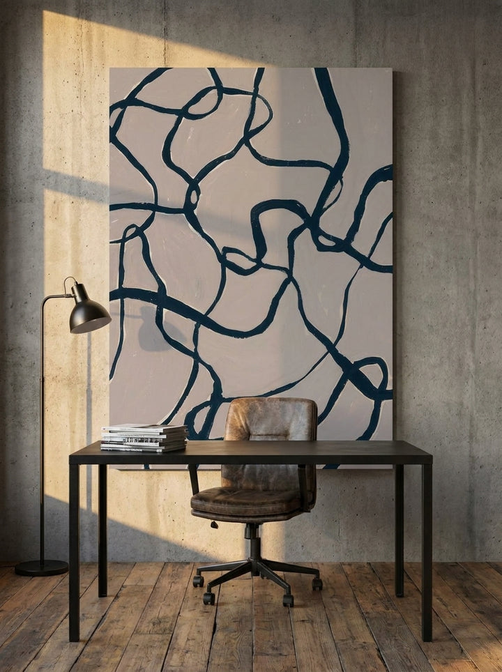 Stretched canvas wall art styled on the wall in an industrial loft home office