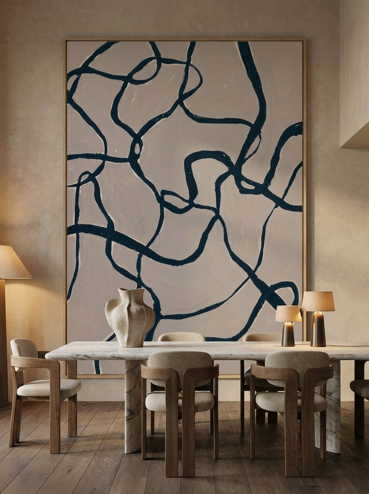 Oversized statement modern wall art print styled on the wall in a luxe dining room