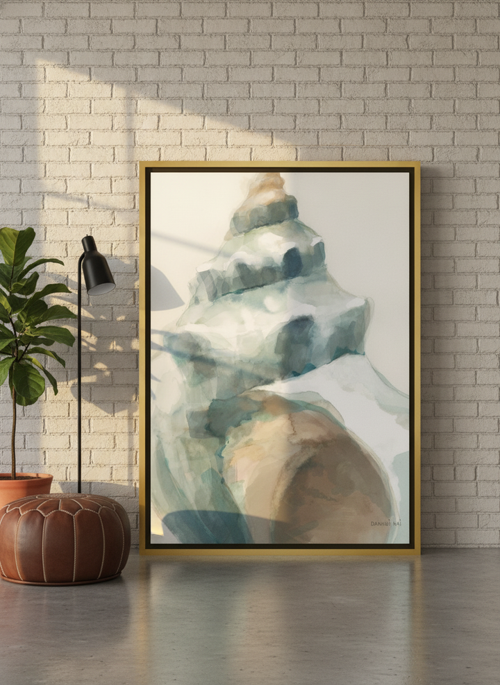 Oversized statement canvas wall art with a gold leaf surround leaning against the wall in an industrial loft dining room