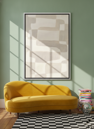 Oversized statement canvas wall art with a silver leaf surround styled on the wall in a colourful eclectic living room