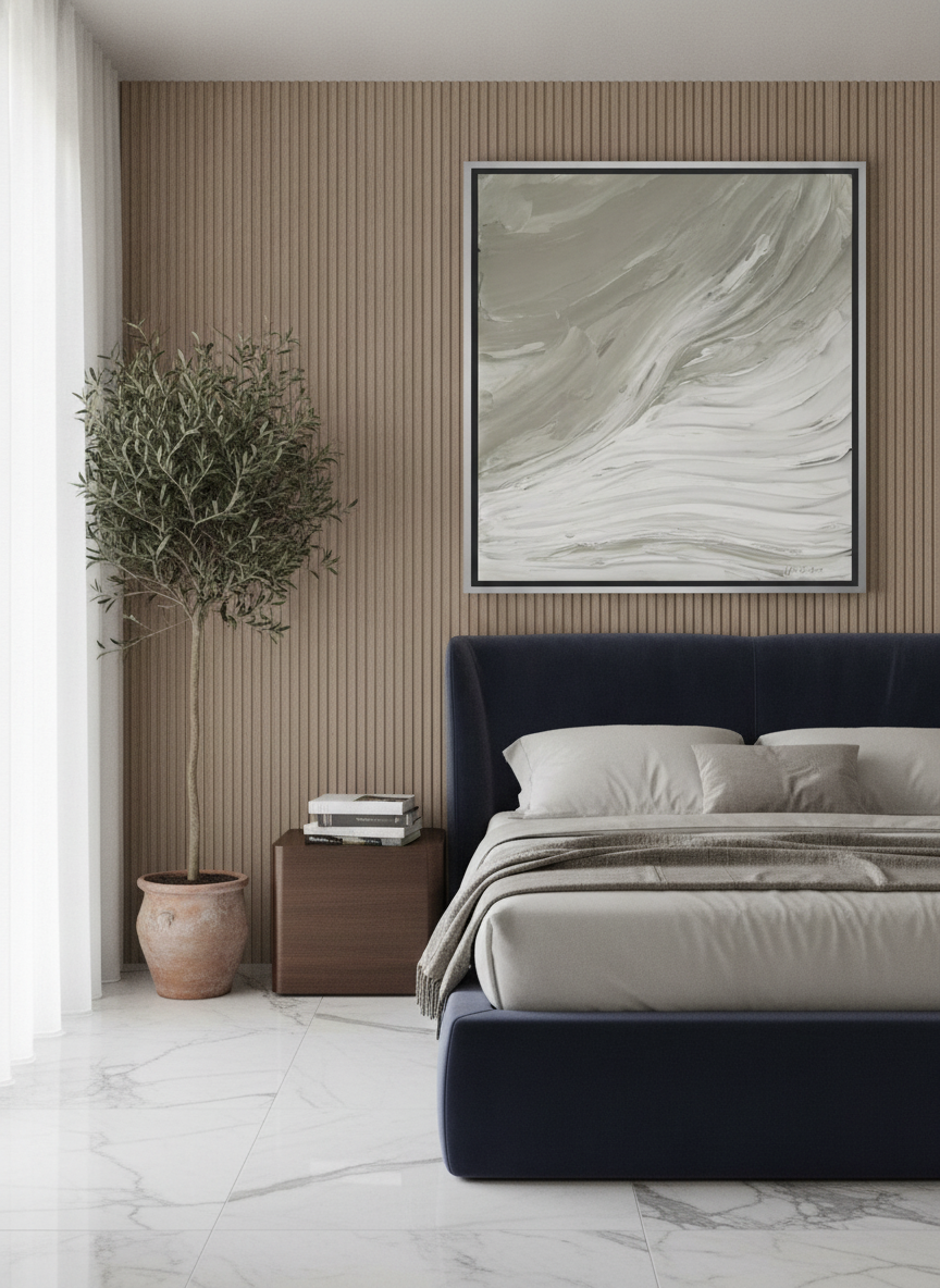 Oversized statement canvas wall art with a silver leaf surround styled on the wall in a luxe bedroom
