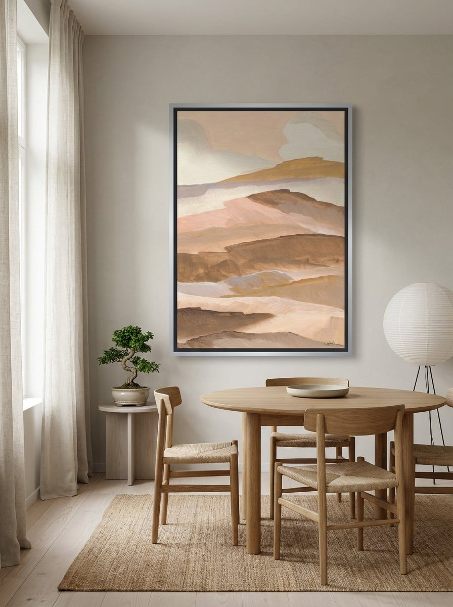 Oversized statement canvas wall art with a silver leaf surround styled on the wall in a warm Japandi dining room
