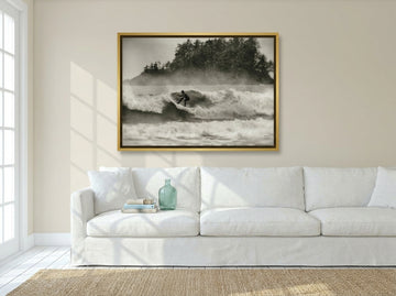 Canvas wall art with a gold leaf surround styled on the wall in a coastal living room