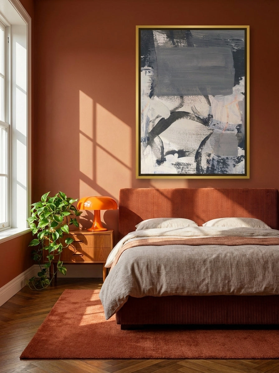 Canvas wall art with a gold leaf surround styled on the wall in a retro 70s bedroom