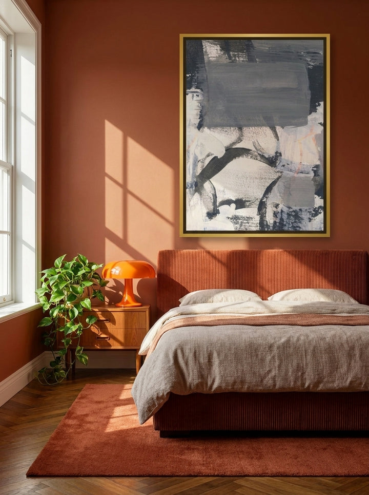 Canvas wall art with a gold leaf surround styled on the wall in a retro 70s bedroom