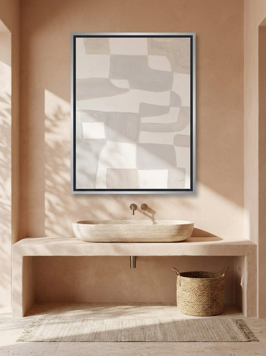Canvas wall art with a silver leaf surround styled on the wall in a Mediterranean bathroom