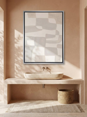 Canvas wall art with a silver leaf surround styled on the wall in a Mediterranean bathroom