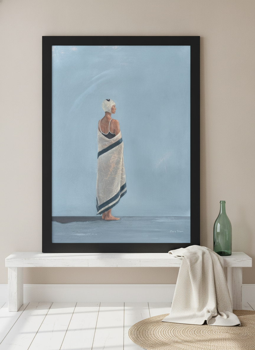 Modern wall art print standing on a console in a coastal bedroom