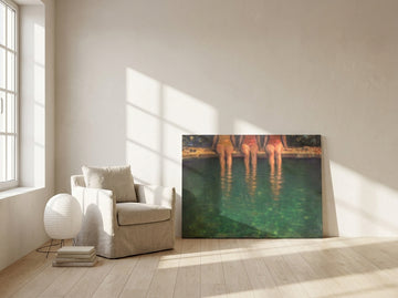 Stretched canvas wall art leaning against the wall in a warm Japandi bathroom