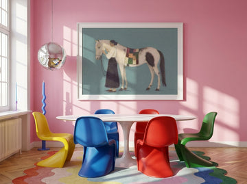 Oversized statement modern wall art print styled on the wall in a colourful eclectic dining room