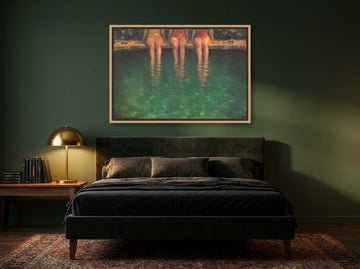 Canvas wall art with a natural timber surround styled on the wall in a moody bedroom