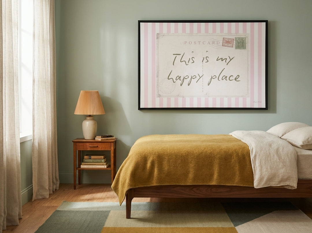 Canvas wall art with a black surround styled on the wall in a mid-century bedroom