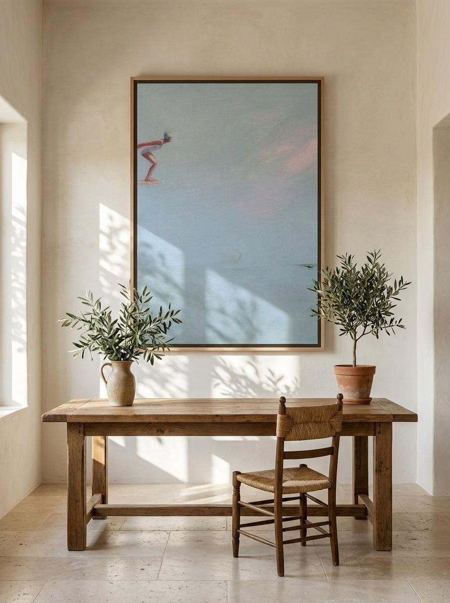 Oversized statement canvas wall art with a natural timber surround styled on the wall in a Mediterranean home office
