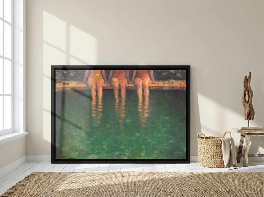 Oversized statement canvas wall art with a black surround leaning against the wall in a coastal living room