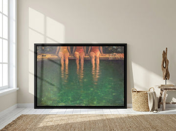Oversized statement canvas wall art with a black surround leaning against the wall in a coastal living room