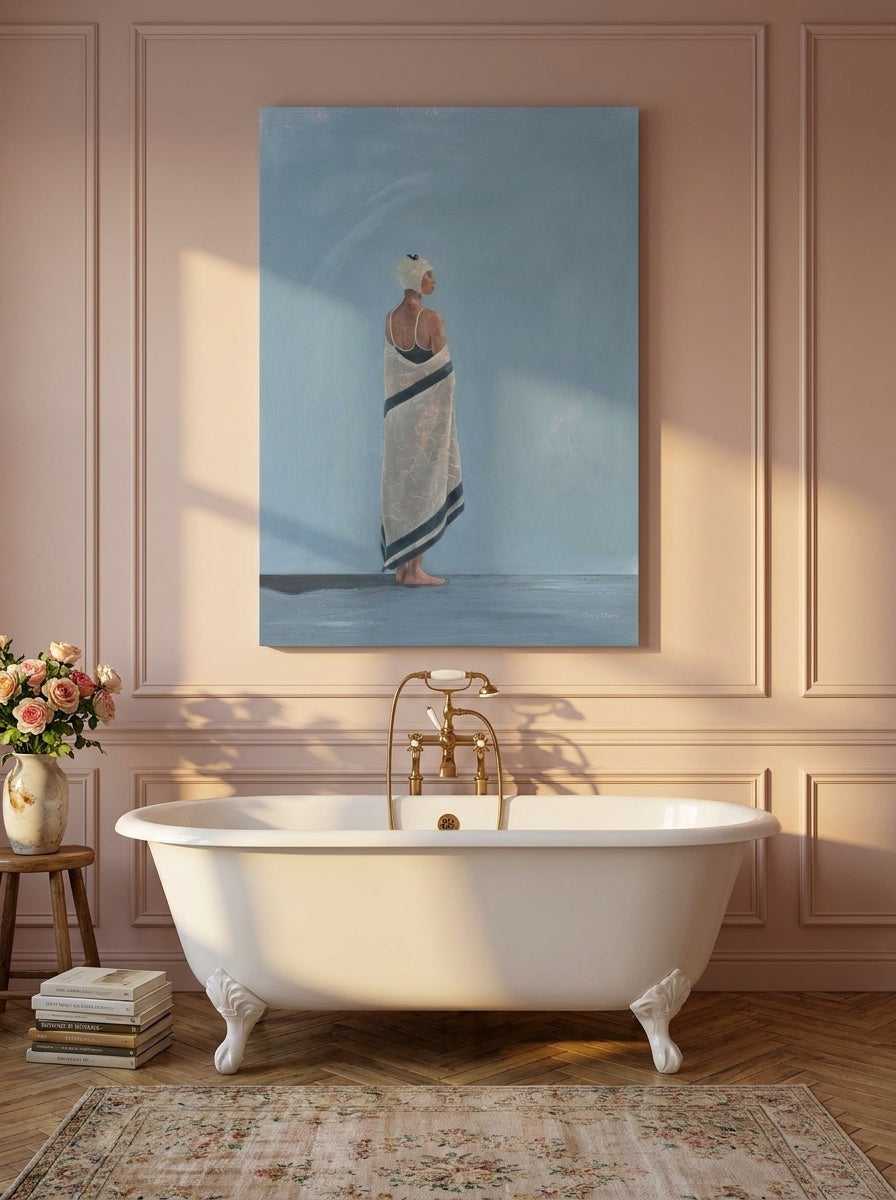 Stretched canvas wall art styled on the wall in a Parisian bathroom