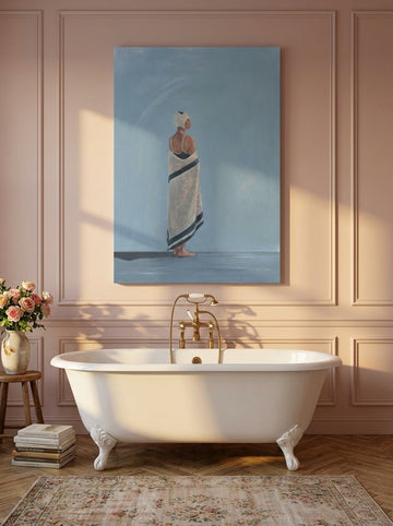 Stretched canvas wall art styled on the wall in a Parisian bathroom