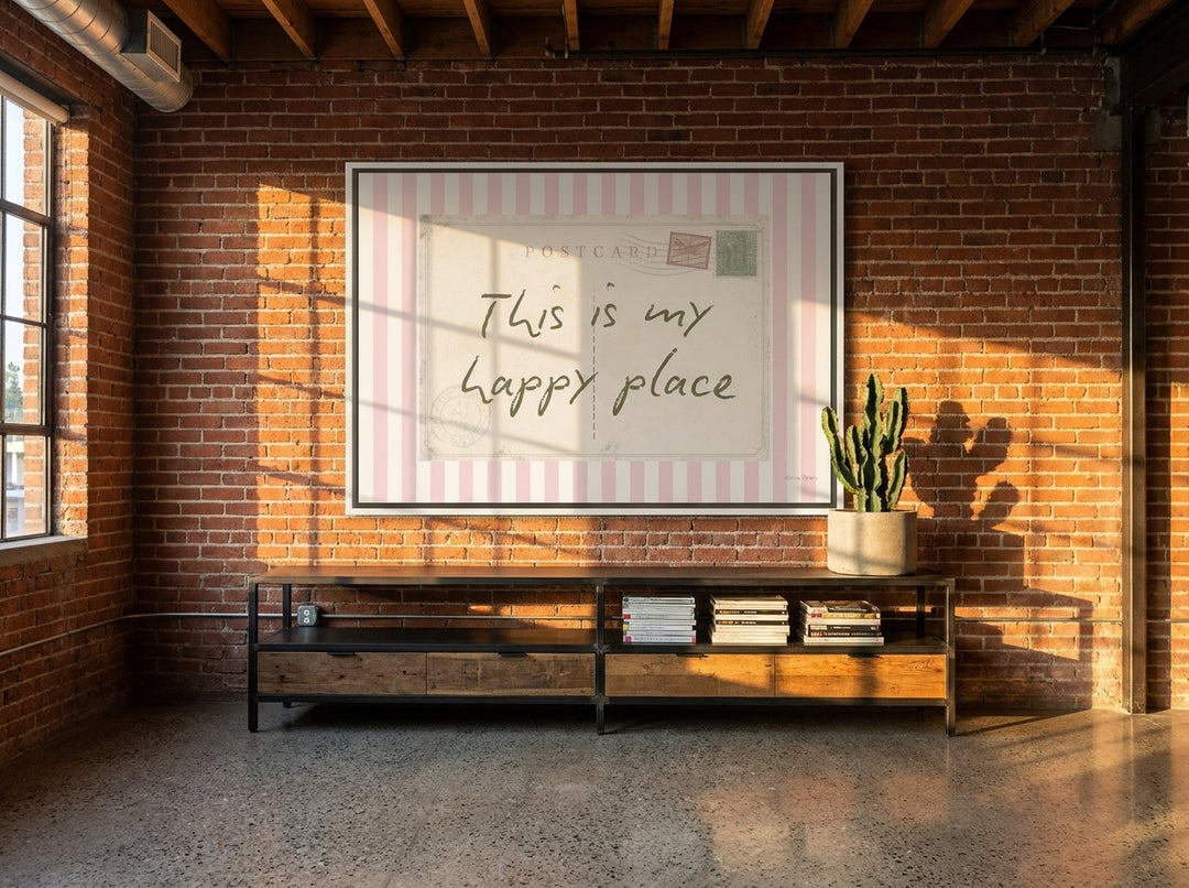 Oversized statement canvas wall art with a white surround styled on the wall in an industrial loft living room