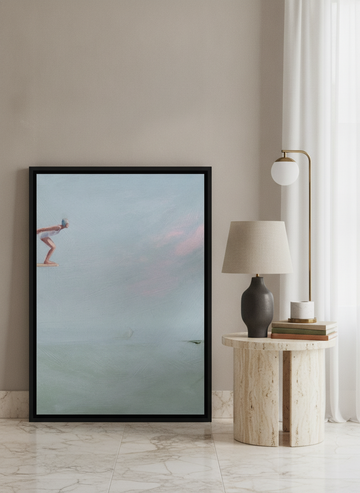 Canvas wall art with a black surround leaning against the wall in a luxe bathroom