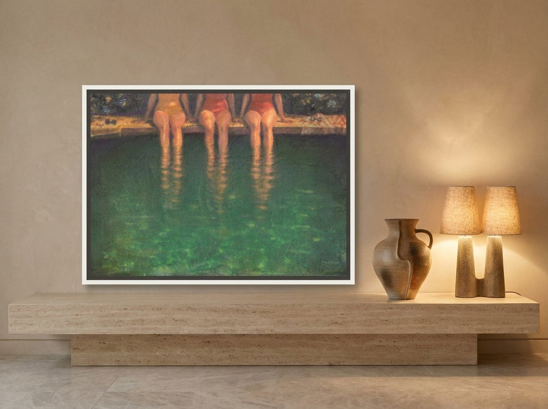 Canvas wall art with a white surround standing on a console in a luxe living room