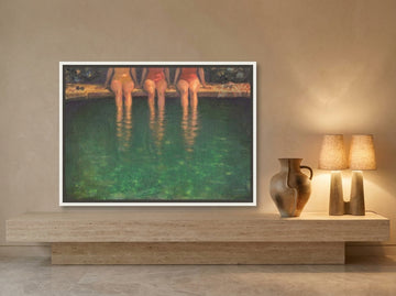 Canvas wall art with a white surround standing on a console in a luxe living room