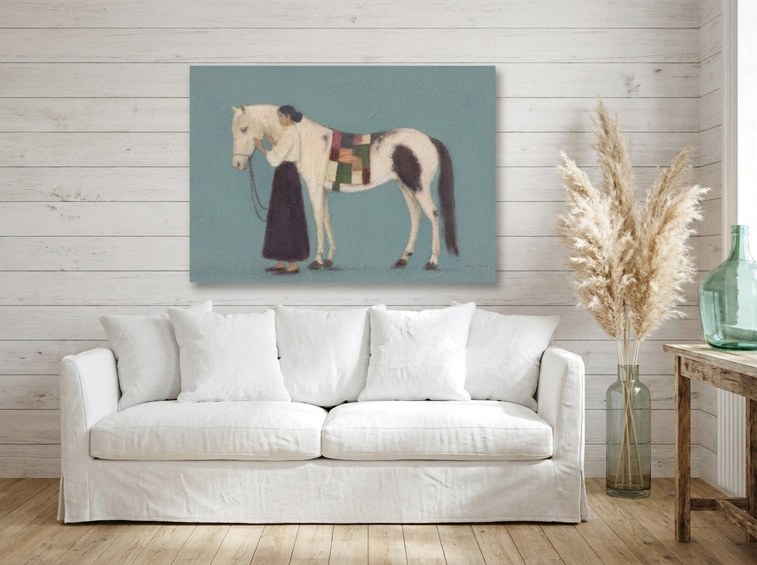 Stretched canvas wall art styled on the wall in a coastal living room