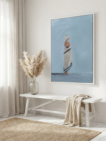 Canvas wall art with a white surround styled on the wall in a coastal living room