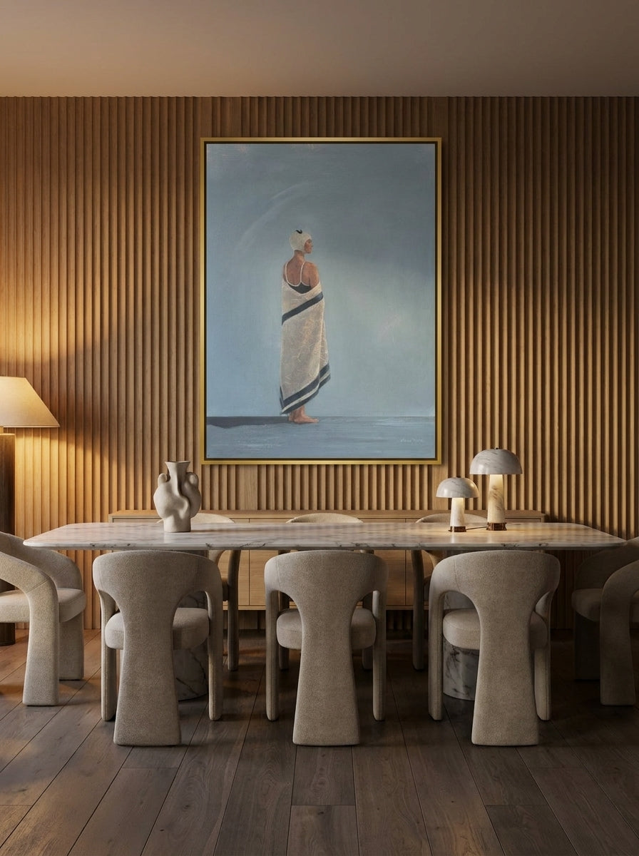 Oversized statement canvas wall art with a gold leaf surround styled on the wall in a luxe dining room
