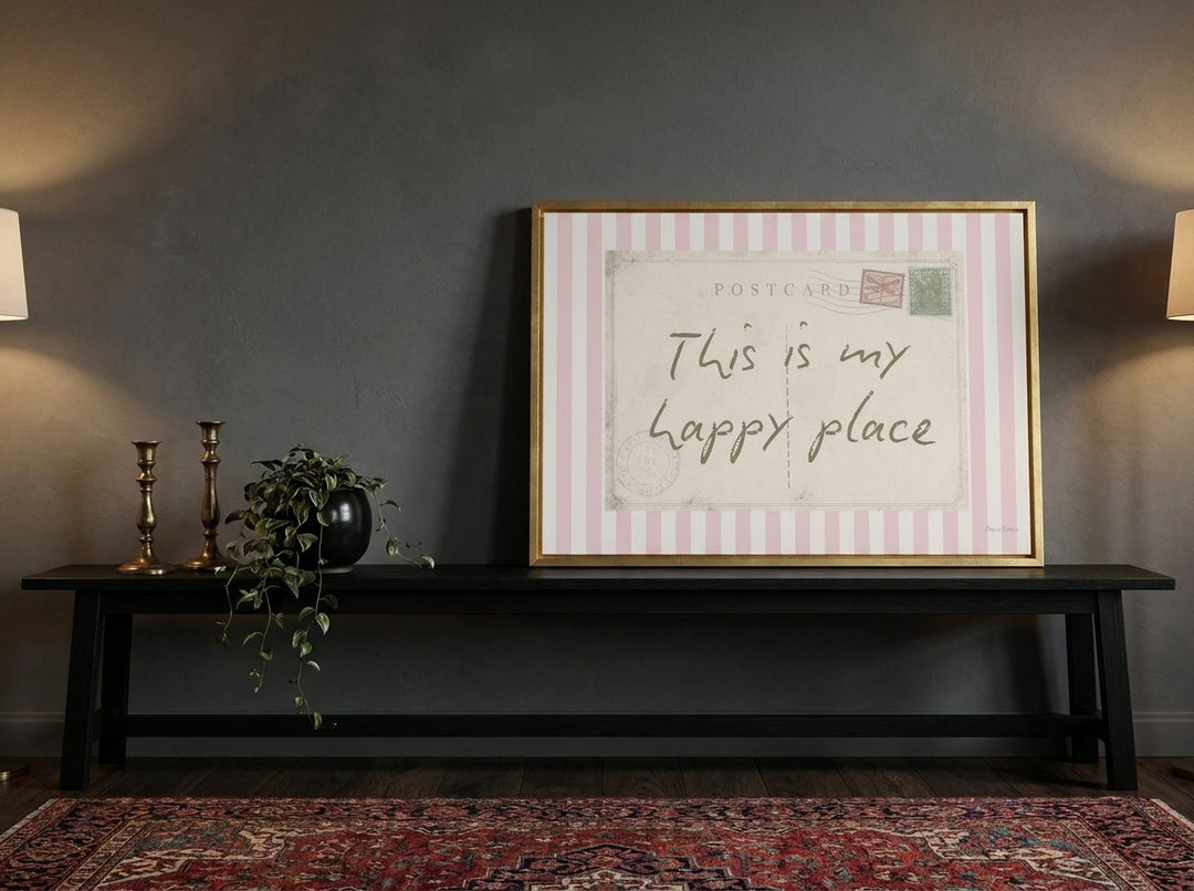 Canvas wall art with a gold leaf surround standing on a console in a moody home office