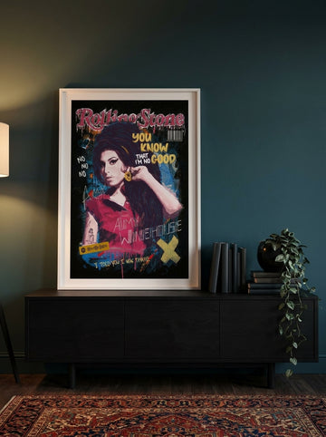 Modern wall art print standing on a console in a moody bedroom