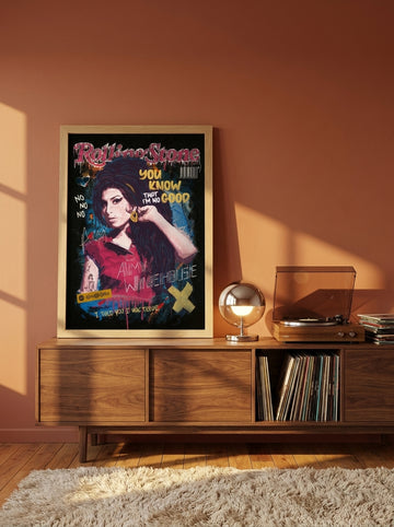 Modern wall art print standing on a sideboard in a retro 70s home office