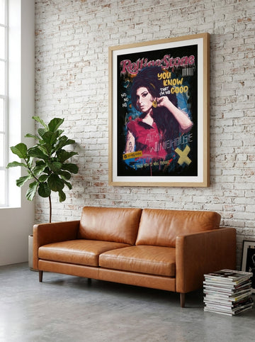 Modern wall art print styled on the wall in an industrial loft living room