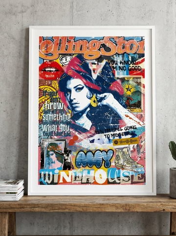 Modern wall art print standing on a bench in an industrial loft bedroom
