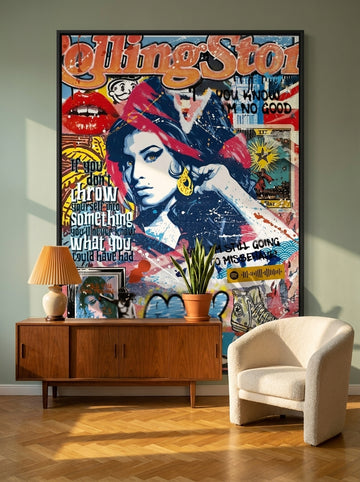 Oversized statement canvas wall art with a black surround styled on the wall in a mid-century living room