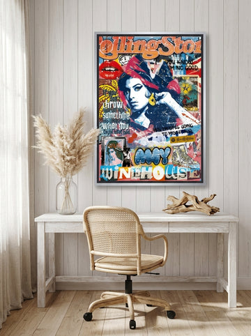 Canvas wall art with a silver leaf surround styled on the wall in a coastal home office