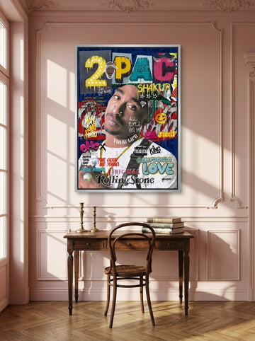 Canvas wall art with a silver leaf surround styled on the wall in a Parisian home office