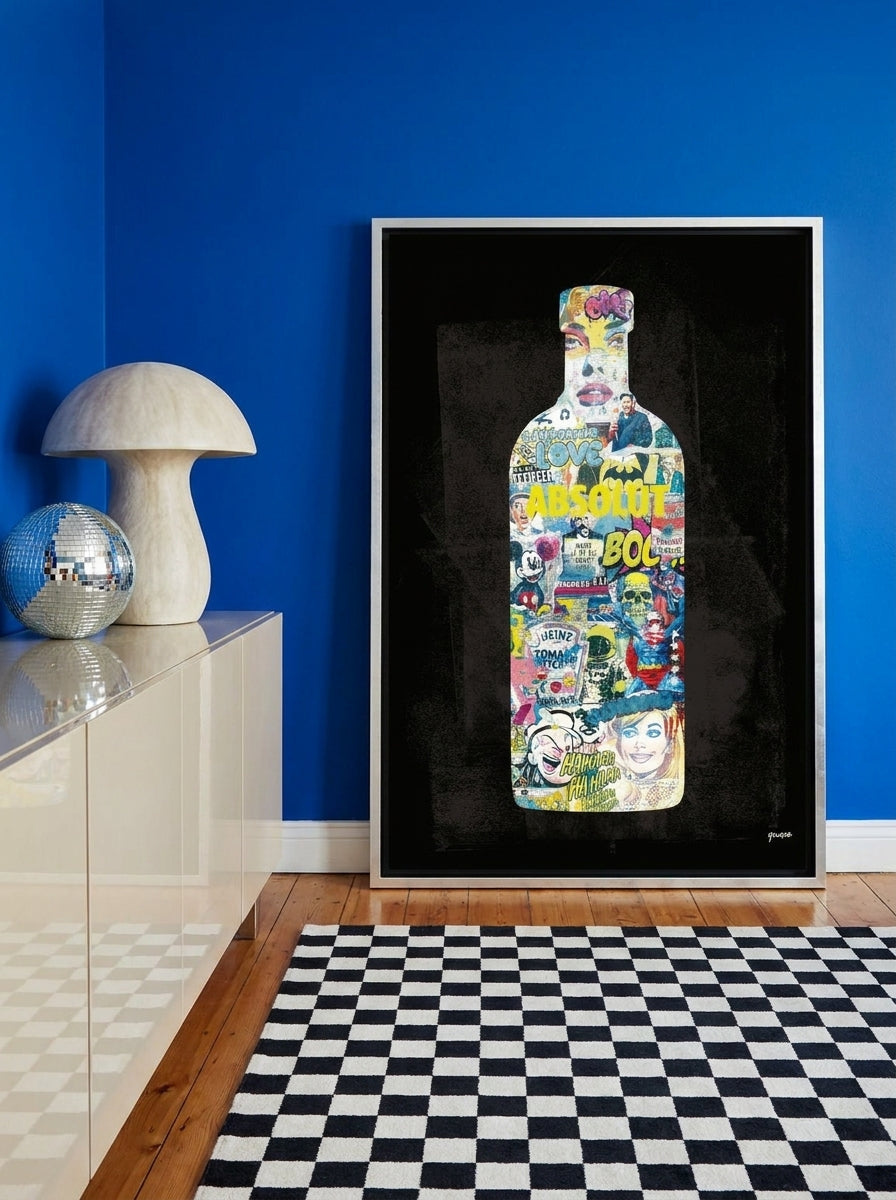 Canvas wall art with a silver leaf surround standing on a sideboard in a colourful eclectic living room