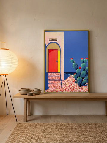 Canvas wall art with a gold leaf surround standing on a kitchen bench in a warm Japandi kitchen