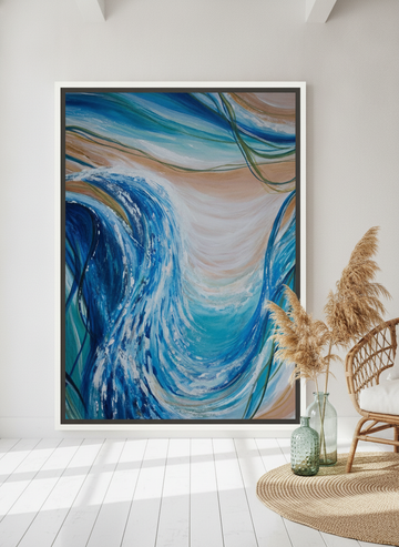 Oversized statement canvas wall art with a white surround leaning against the wall in a coastal dining room