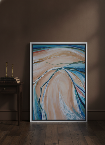 Canvas wall art with a silver leaf surround leaning against the wall in a moody bedroom
