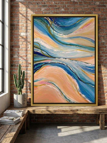 Canvas wall art with a gold leaf surround standing on a bench in an industrial loft living room