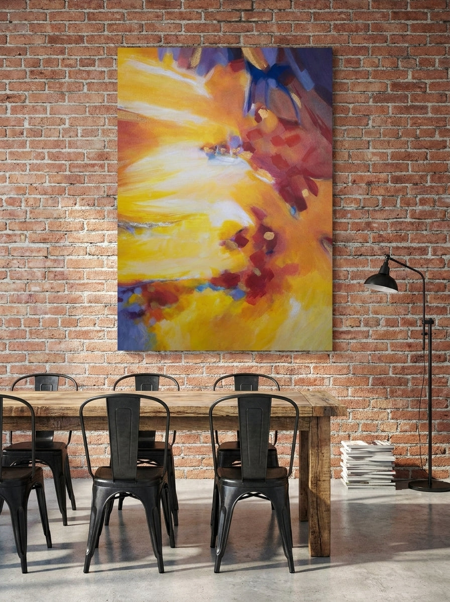 Stretched canvas wall art styled on the wall in an industrial loft dining room