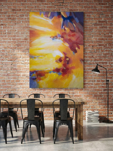 Stretched canvas wall art styled on the wall in an industrial loft dining room