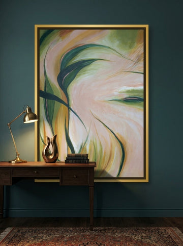 Canvas wall art with a gold leaf surround styled on the wall in a moody home office