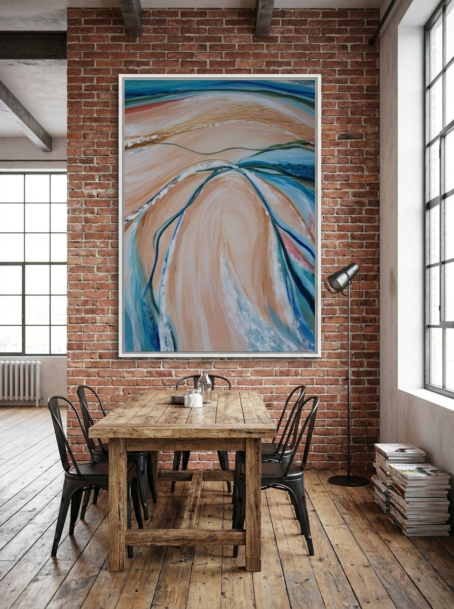 Oversized statement canvas wall art with a white surround styled on the wall in an industrial loft dining room